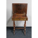 A late 19th century walnut work table