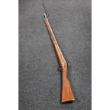 A replica long rifle with bayonet CONDITION REPORT: This is a non-firing decorative