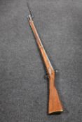 A replica long rifle with bayonet CONDITION REPORT: This is a non-firing decorative