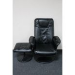 A black leather swivel armchair with matching footstool