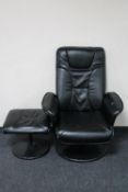 A black leather swivel armchair with matching footstool