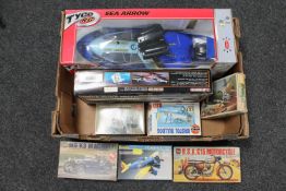 A box containing eight assorted modelling kits including aircraft, BSA motorcycle, MG car,