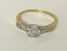 An 18ct gold diamond set ring, size M. CONDITION REPORT: 2.