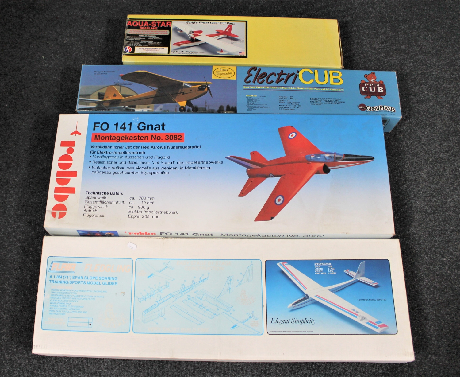 Four boxed model planes to include a Flaia Fledgling Glider, Aqua Star Sea Plane,