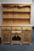 An antique pine farmhouse kitchen dresser