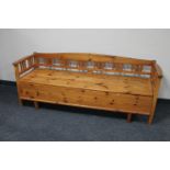 An early 20th century pine storage hall seat