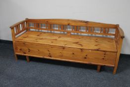 An early 20th century pine storage hall seat