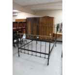 A Victorian brass and cast iron bed