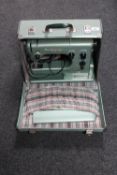 A cased Husquvarna zig zag electric sewing machine