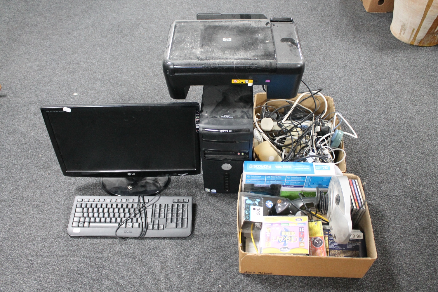 An LG PC monitor, Dell disc drive and keyboard, two boxes of leads, accessories,