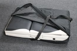 A folding portable massage bag in carry bag