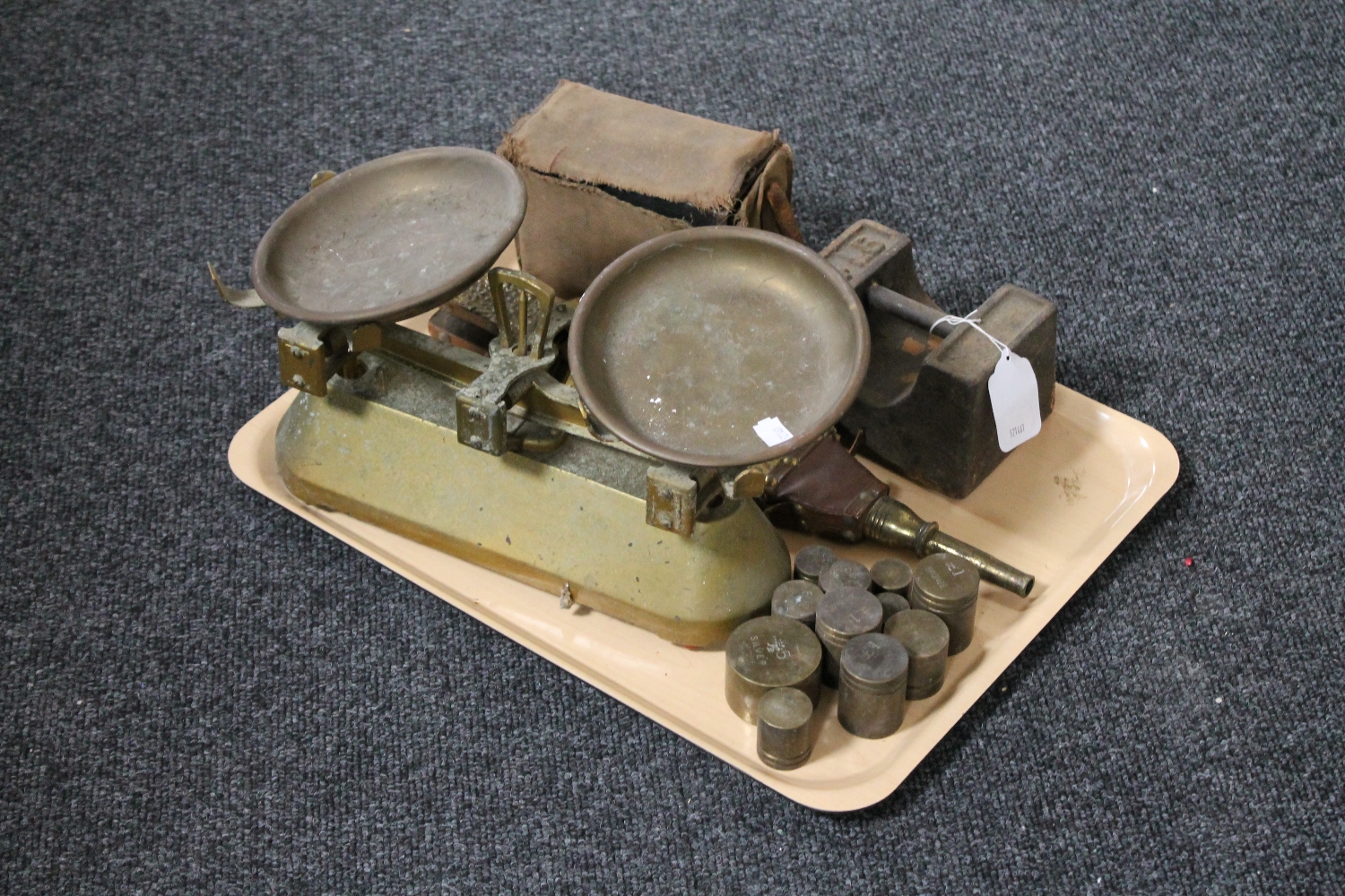 A tray of antique pan, kitchen scales, assorted weights, brass embossed bellows,