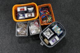 A tray of six baskets of a large quantity of costume jewellery, bangles, wristwatches,