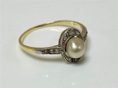 A 14ct yellow gold natural pearl and diamond ring, size N.