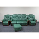 A three piece green leather lounge suite with matching footstool