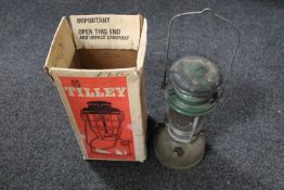 A boxed Tilley storm light