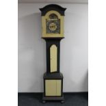 An antique continental painted longcase clock with brass dial