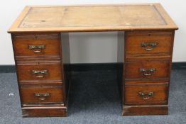 An Edwardian oak twin pedestal desk by Robsons on Newcastle