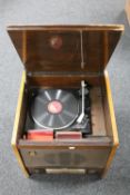 A 20th century MRG walnut cased stereo system together with a cabinet containing a quantity of 78's