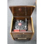 A 20th century MRG walnut cased stereo system together with a cabinet containing a quantity of 78's