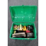 A plastic storage box of assorted cameras, lens cases,