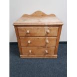 An antique pine three drawer chest