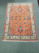 A Malayer rug, on salmon ground,