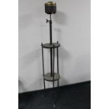 An antique rise and fall wrought iron oil lamp base