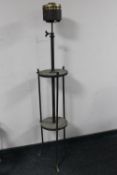 An antique rise and fall wrought iron oil lamp base