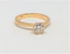 An 18ct gold solitaire diamond ring, the brilliant-cut stone weighing approximately 0.