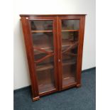 An Edwardian mahogany double door bookcase