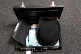 A leather cased containing Freemasons regalia and literature together with a gent's bowler hat