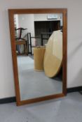 A large teak framed overmantel mirror