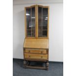 An early 20th century oak bureau bookcase