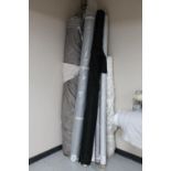 Twelve rolls of assorted fabric