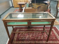 An Edwardian glazed oak shop display cabinet,