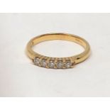 An 18ct gold five stone diamond ring