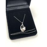A 14ct white gold pearl and diamond pendant on chain
