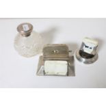 Two early 20th century silver desk calendars together with a silver lidded cut glass perfume bottle
