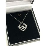 A 10ct gold diamond set pendant on chain