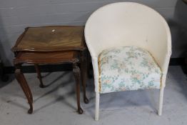 A nest of two mahogany glass topped tables together with a painted loom chair