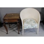 A nest of two mahogany glass topped tables together with a painted loom chair