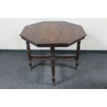 A Victorian oak octagonal occasional table