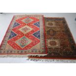 Two fringed Persian design rugs