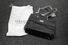 A Versace Parfums lady's bag, with branded protective sack, brand new and never used.