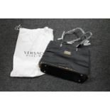 A Versace Parfums lady's bag, with branded protective sack, brand new and never used.