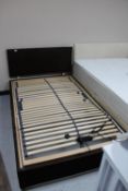 A 4' electric bed base with headboard