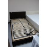 A 4' electric bed base with headboard