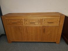 A contemporary oak sideboard,