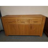 A contemporary oak sideboard,